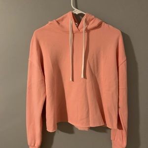 Salmon colored cropped hoodie